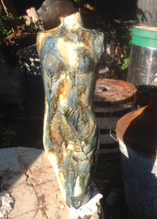 Fern impressed stoneware female figure. 